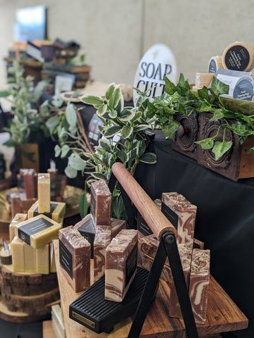 market display with handmade soap and darker timber stands