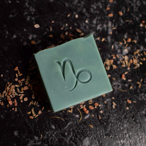 forest green soap with capricorn zodiac symbol stamped on