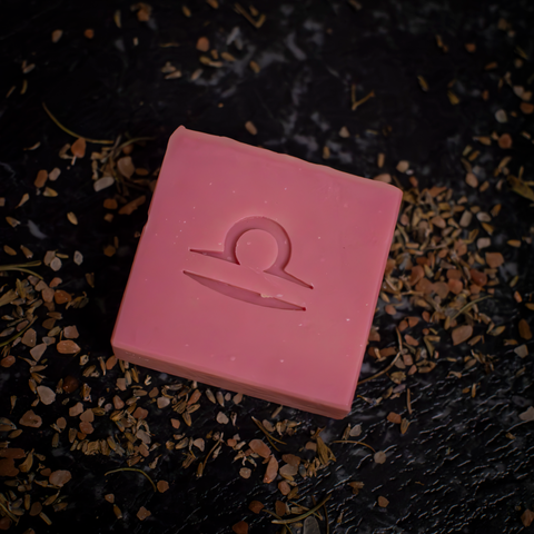 pink libra soap in dark moody setting showing libra stamp