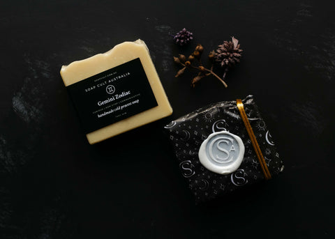 yellow gemini soap on black table with nuts and sticks wrapped bar gift