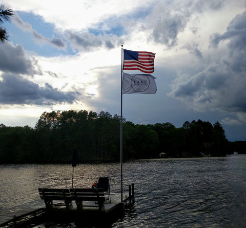 lake effect co and american flag flying on the pier