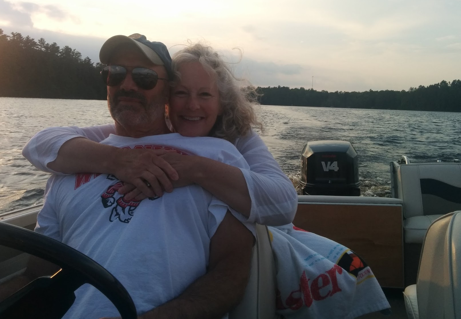 woman hugging husband on the boat