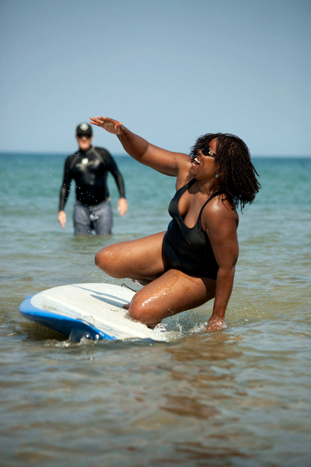 woman learning to surf at the surfrider milwaukee event