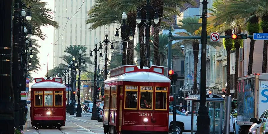 New Orleans trolly cars on busy city street