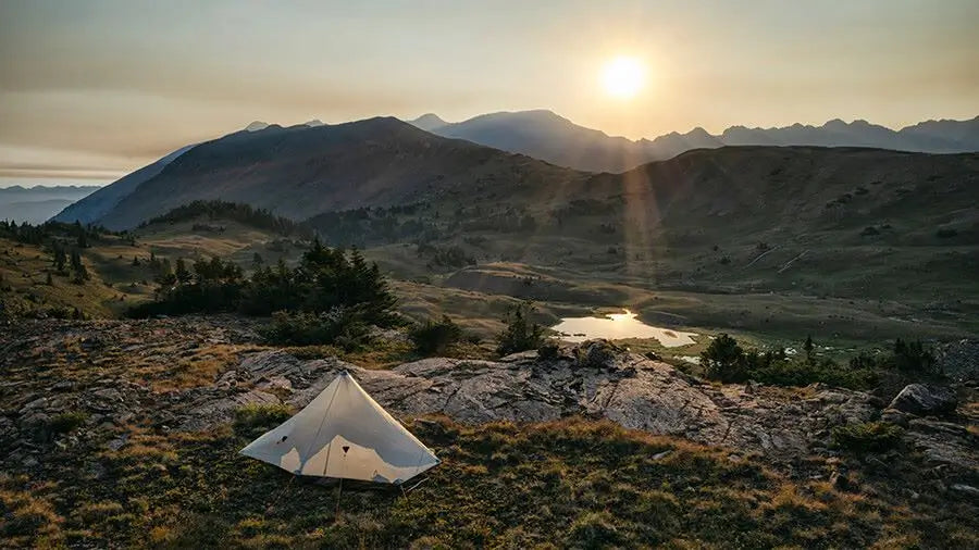tent in nature at sunset