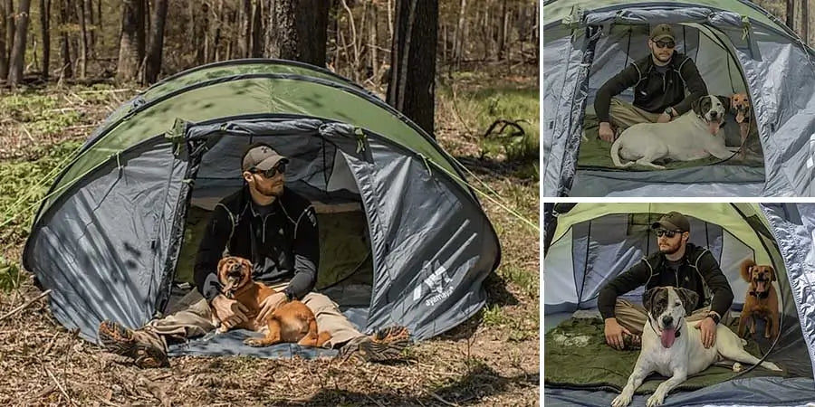 Man and dog sitting inside pop up tent in the forest