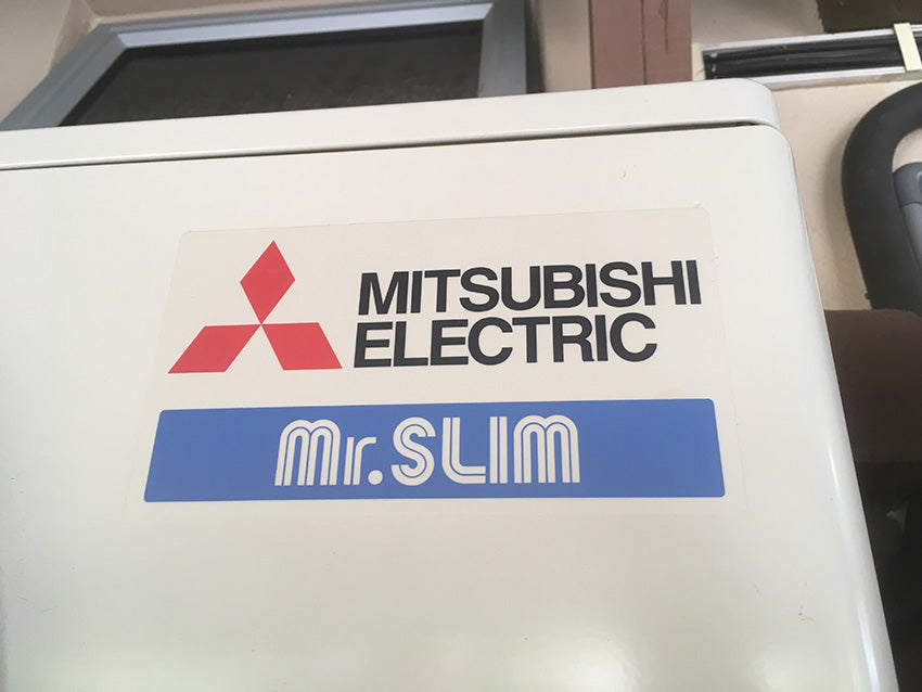 a close up of a mitsubishi electric mr. slim mini split logo