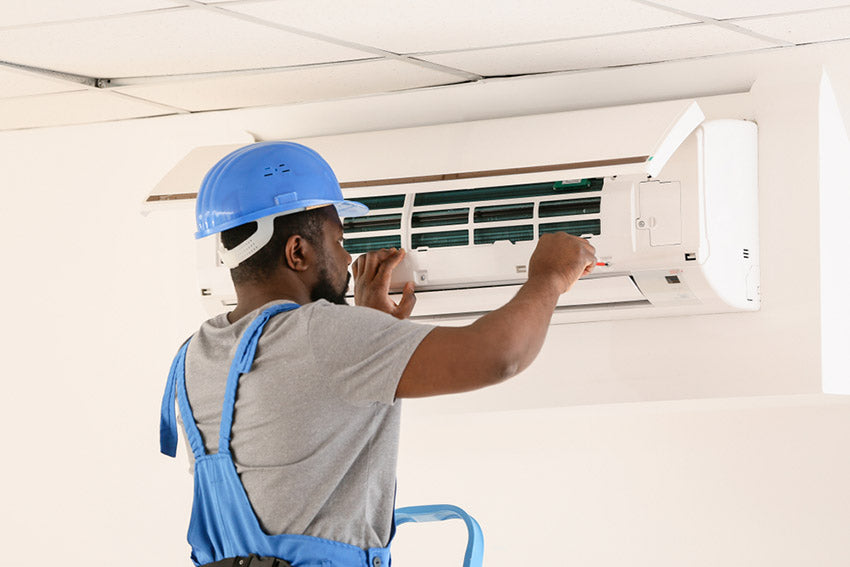 electrician repairing air conditioner