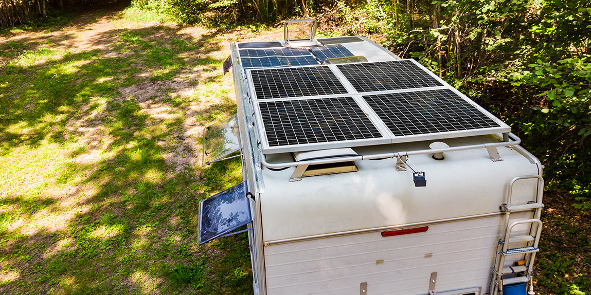 A close-up shot of a solar panel installed on a rooftop van.