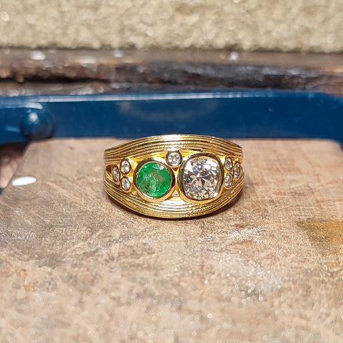 Remodelled ring with diamonds and emerald