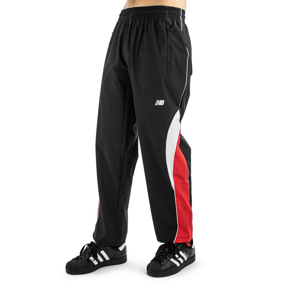 New Balance Trackpant MP53611-BK - schwarz-rot-weiß