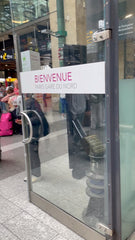 Colour photo of a glass door saying 'Bienvenue: Paris Gare du Nord'