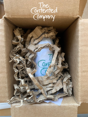 The Contented Company | Contented Earth | Product wrapped in eco-friendly packaging, in reused cardboard box