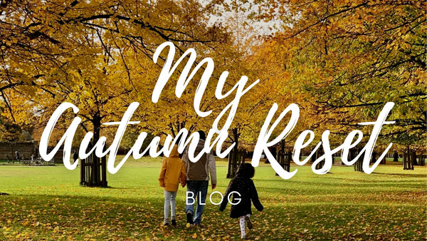 Photo of trees with yellow leaves in background - a dad and two daughters in the foreground, seen from behind | The Contented Company Eco-friendly, Plastic-free, Zero-waste Shop | Blog | Autumn Reset banner