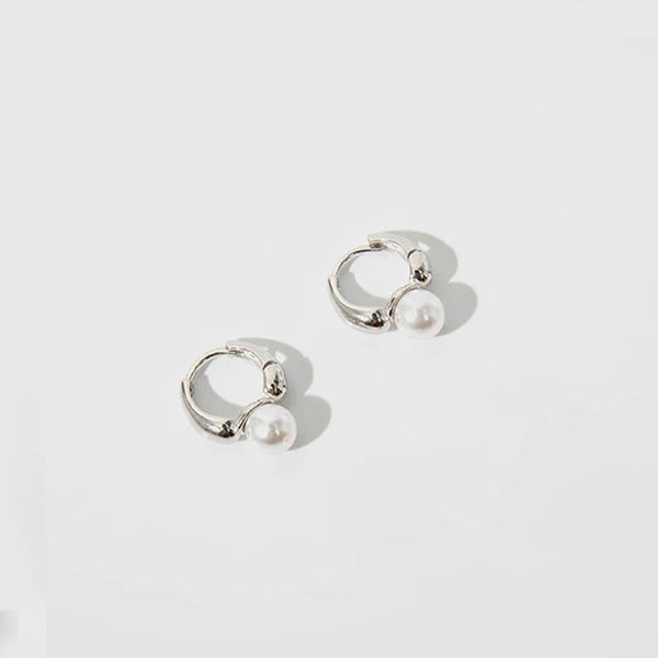 Mini Hoop & Pearl Huggie Earring Set. Shop Earrings on Mounteen. Worldwide shipping available.