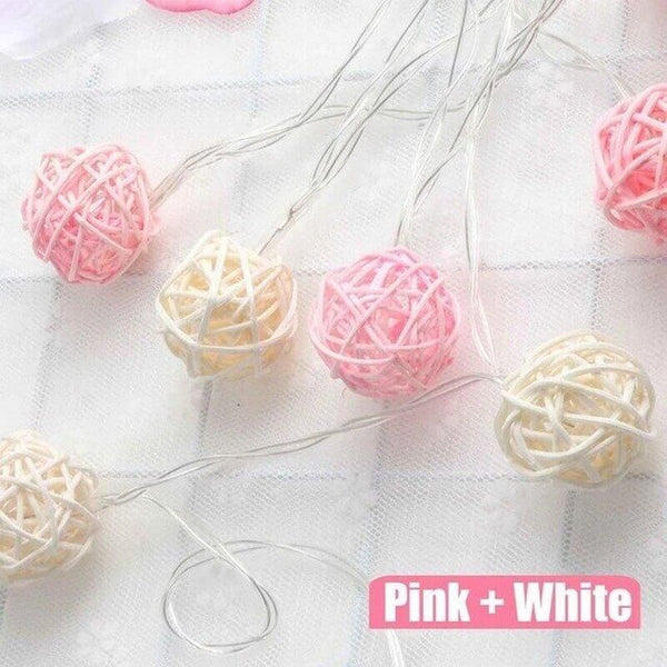 Pink and white rattan ball string lights