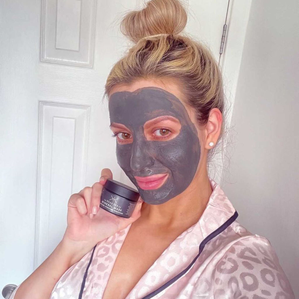 Influencer holding The Dead Sea Co. Face Mask