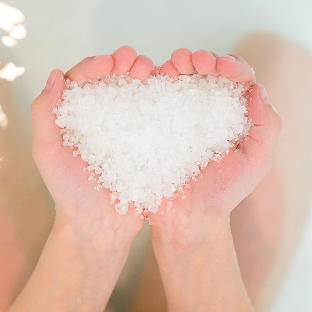 Dead Sea Salt in the shape of a heart about to be put in the bath