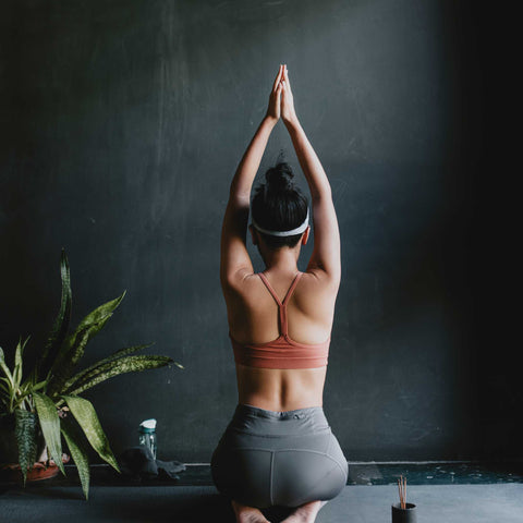 Woman practising yoga as self-care