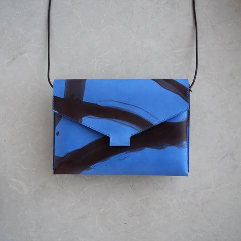 Mokoko Fold Handbag in Blue Painted vegetable tanned leather.