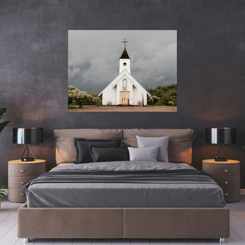 large white church art hanging on wall in grey bedroom scene