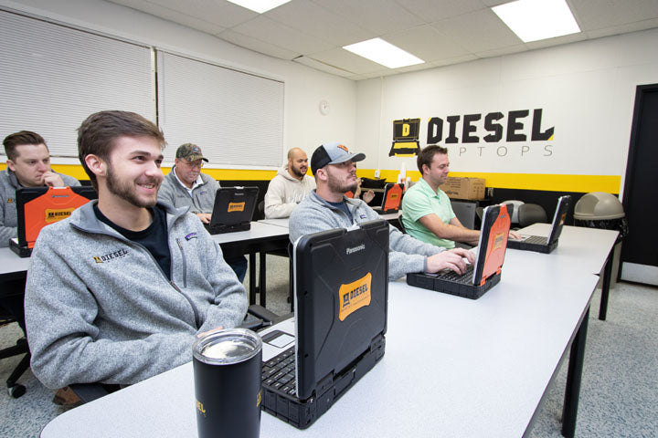 Students learning Diesel Laptops software in class