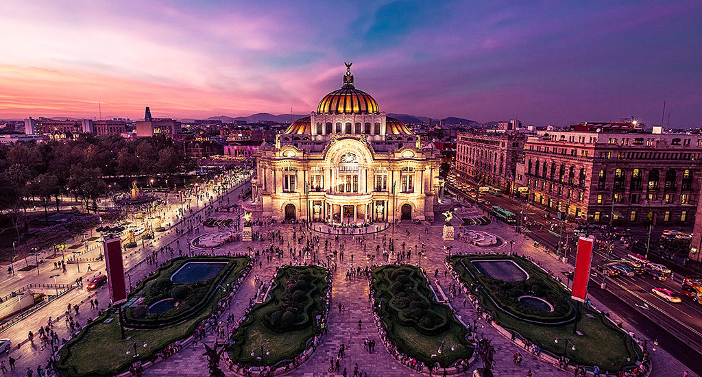 Mexico City Palace with busy crowds at sunset mischa blog