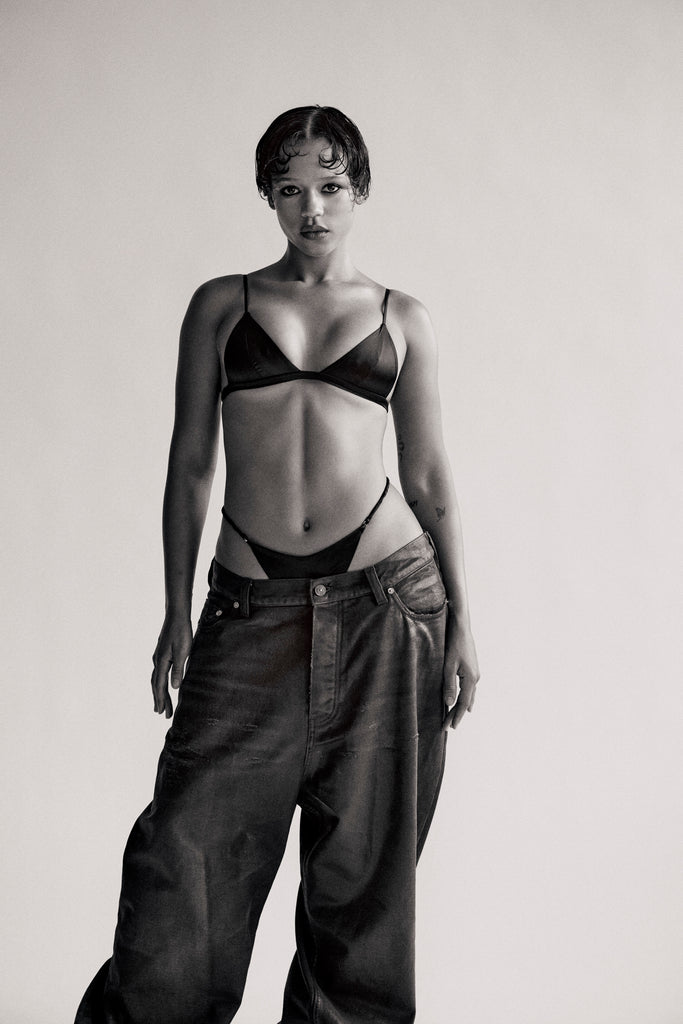 BALENCIAGA jeans; FLEUR DU MAL triangle bra and thong.