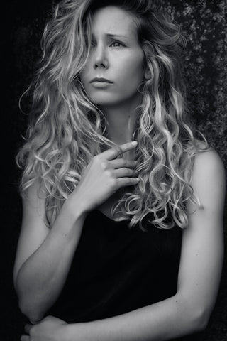 Black and White Portrait of a Young Woman with curly hair