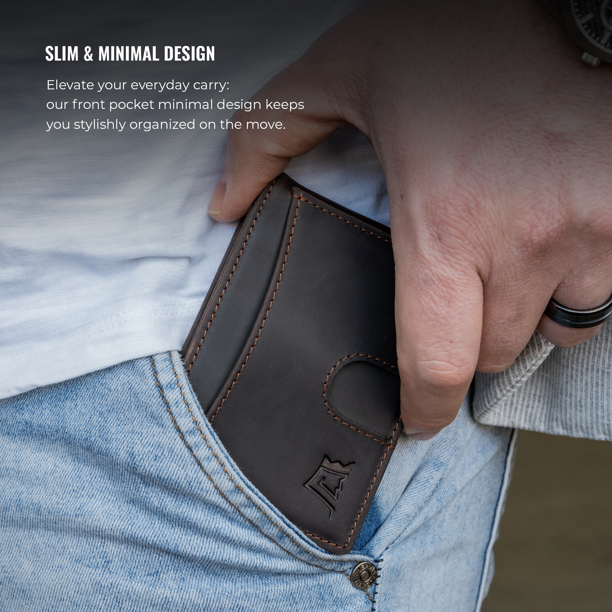 Person inserting a slim leather wallet into their front jeans pocket.