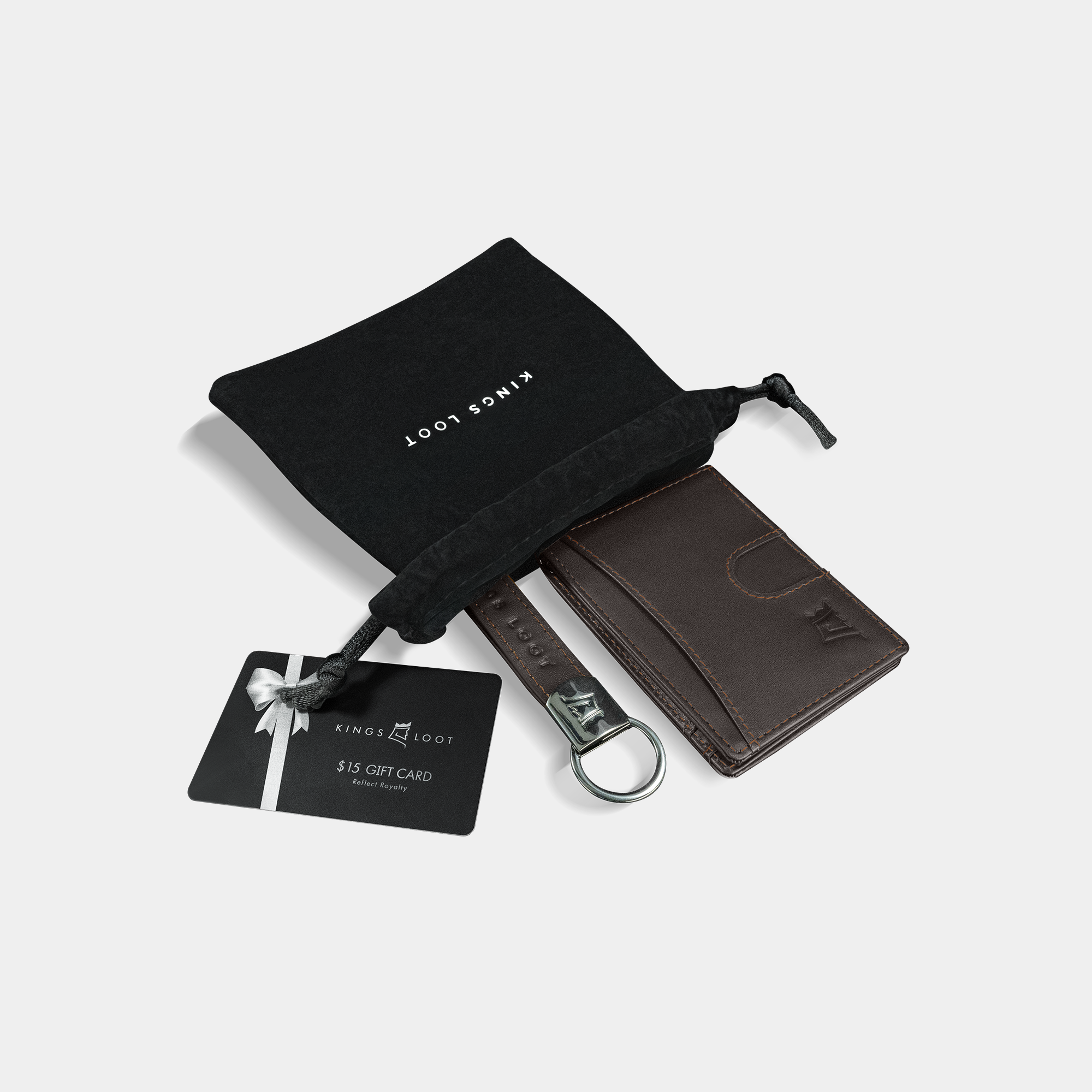 A leather wallet with a keychain and a gift card on a white background.