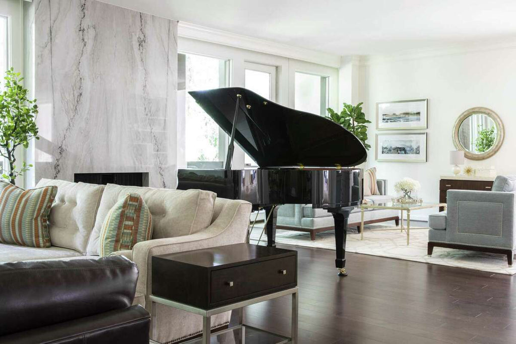 Traditional sofas in a modern living room with a black piano