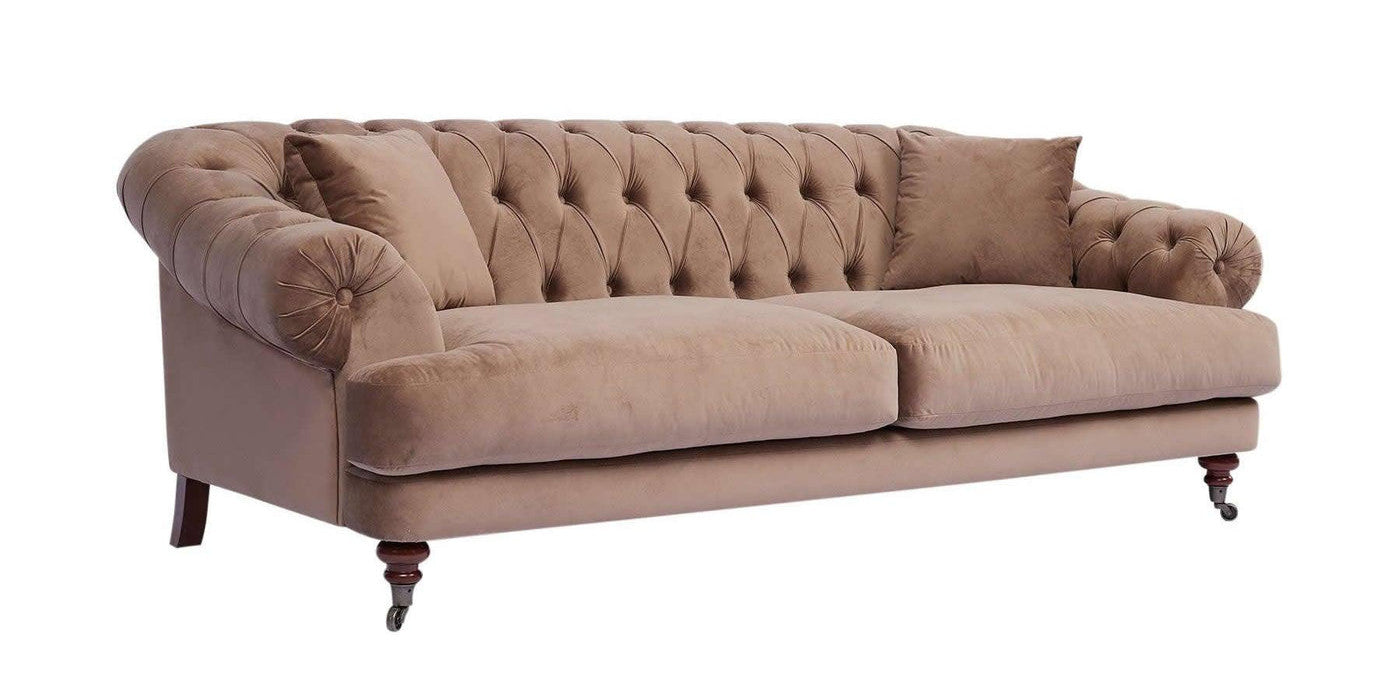 Brown chesterfield sofa with deep buttons and rolled arms