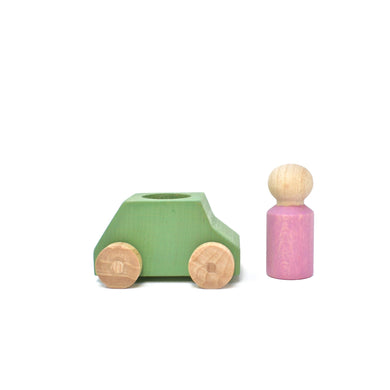 Green wooden car with pink figure