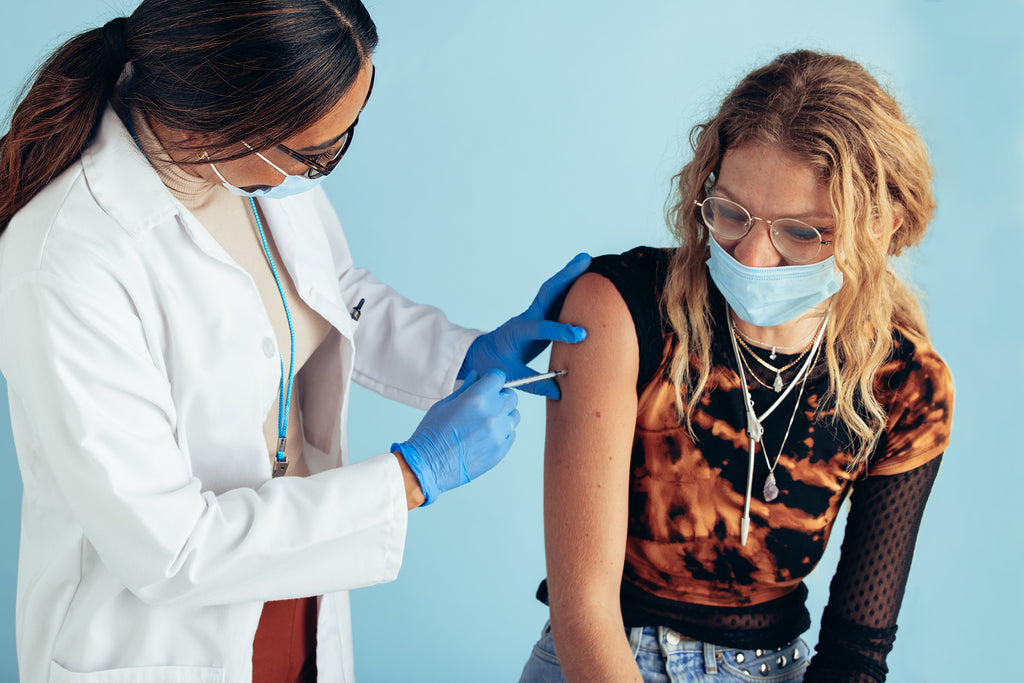 Woman receiving covid-19 vaccine