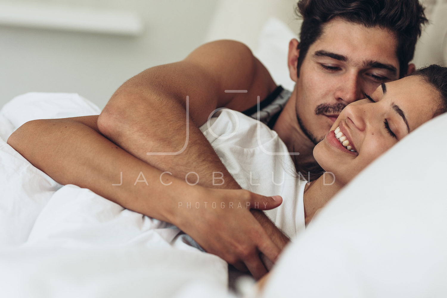 Cute couple together in bed – Jacob Lund Photography Store ...