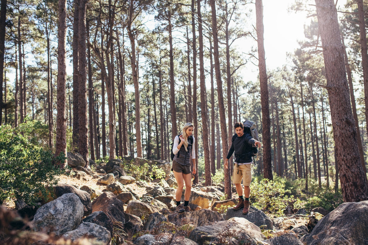 Hiking Couple Walking On Rocks In Forest Wearing Backpacks Jacob Lund Photography Store