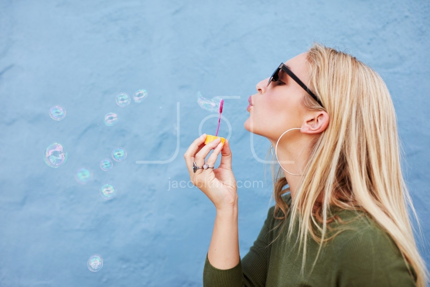 blowing soap bubbles