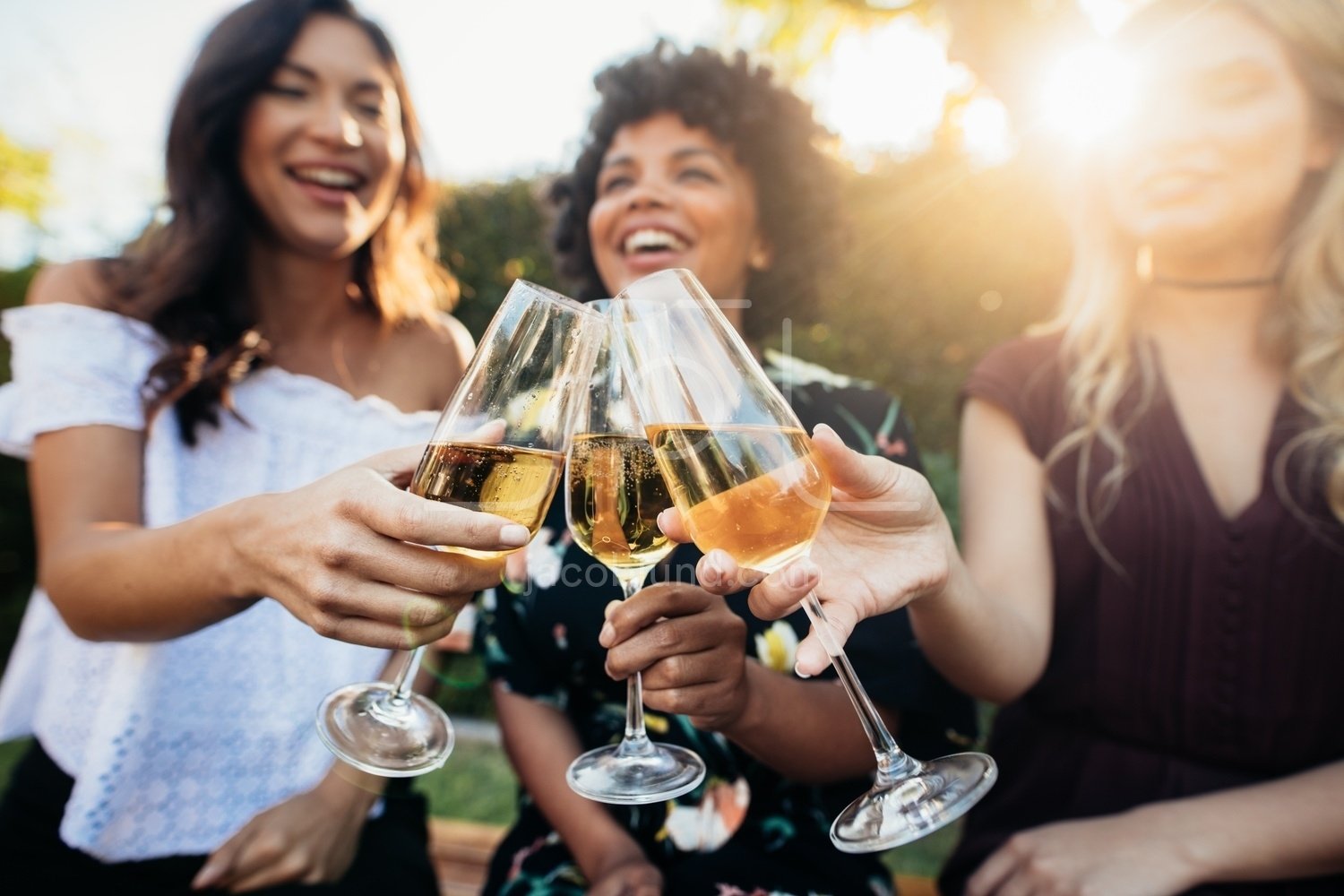 Female friends having drinks at party outdoors – Jacob Lund Photography ...