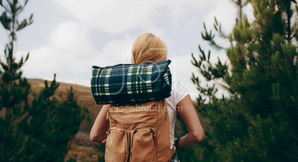 Rear View Of A Explorer Woman Carrying Travelling Kit Jacob Lund Photography Store Premium