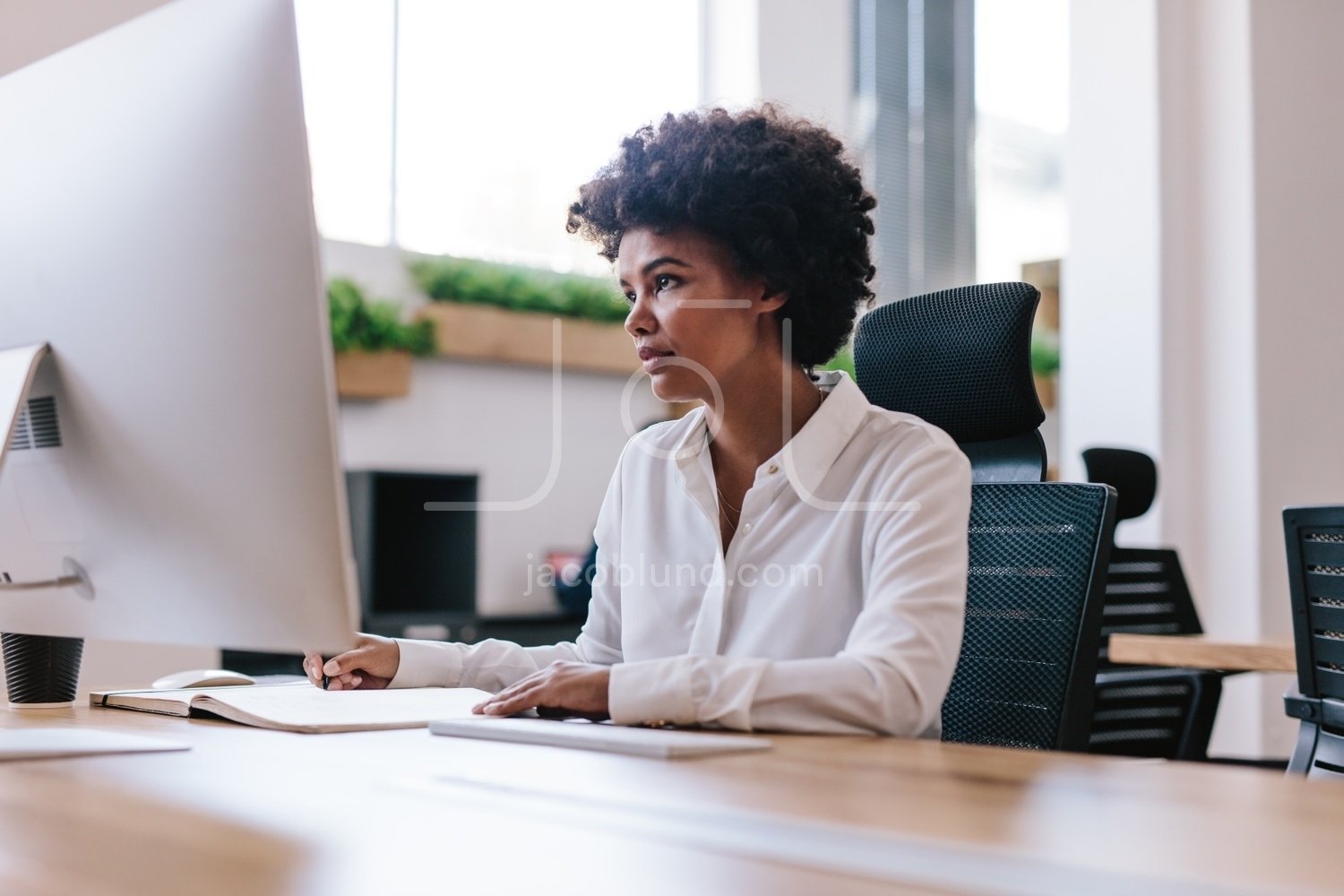 African Woman Working At Her Office Desk Jacob Lund Photography