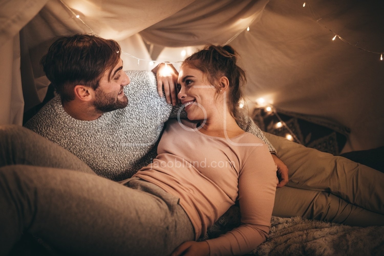 Couple talking while lying on bed – Jacob Lund Photography Store ...
