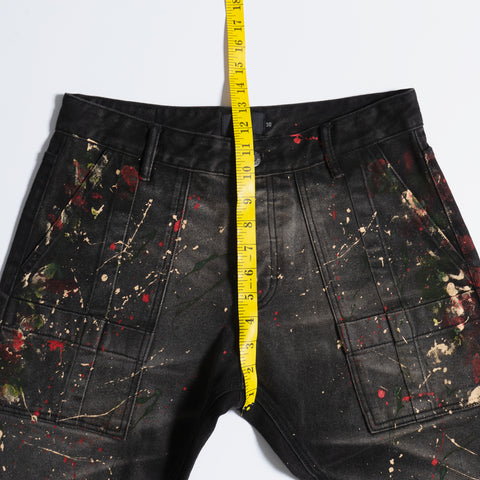 Measuring black paint splatter jeans front rise