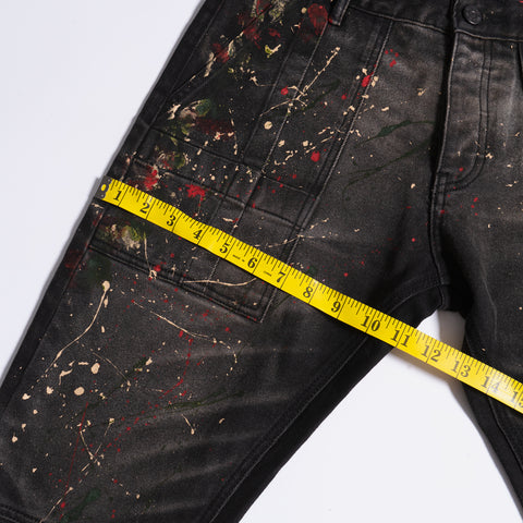 Measuring black paint splatter jeans hip size