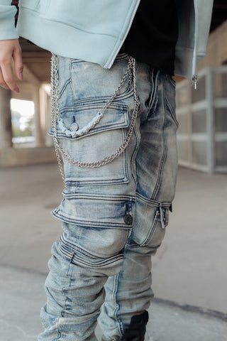 Kyle blue cargo jeans paired with silver biker pant chain