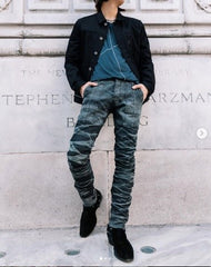 Waist down photo with stacked pants and nice sneakers