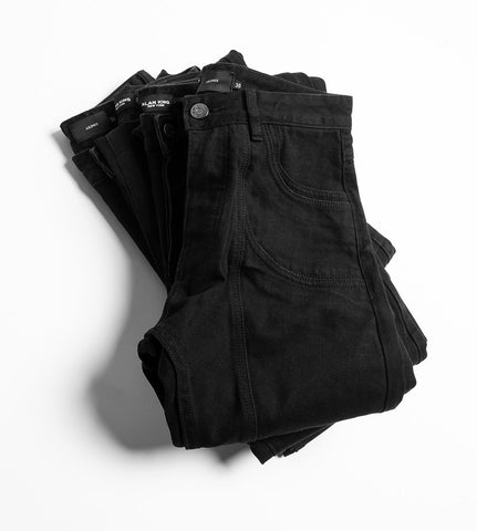 Pile of Black Jeans for Men