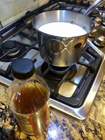 Simmering the milk for cheese making