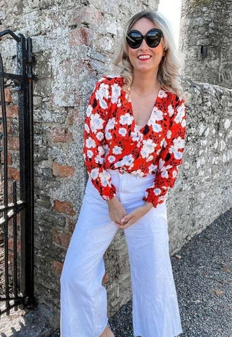 red blouse with white floral print