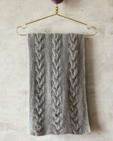 Baby blanket with knitted cables